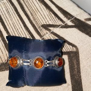 Amber and Silver adjustable bracelet.